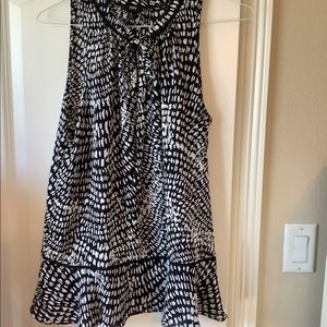 Mossimo sleeveless black and white top with tie at the neck. Size Large.